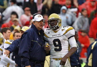 ATHENS, GA - NOVEMBER 29:  Head coach Paul Johnson and quarterback Josh Nesbitt #9 of the Georgia Tech Yellow Jackets share a discussion during a timeout in the game against the Georgia Bulldogs at Sanford Stadium on November 29, 2008 in Athens, Georgia.  The Yellow Jackets defeated the Bulldogs 45-42.  (Photo by Mike Zarrilli/Getty Images)