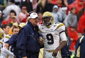 ATHENS, GA - NOVEMBER 29:  Head coach Paul Johnson and quarterback Josh Nesbitt #9 of the Georgia Tech Yellow Jackets share a discussion during a timeout in the game against the Georgia Bulldogs at Sanford Stadium on November 29, 2008 in Athens, Georgia.  The Yellow Jackets defeated the Bulldogs 45-42.  (Photo by Mike Zarrilli/Getty Images)
