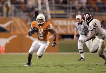 AUSTIN, TX - NOVEMBER 27:  Vondrell McGee #2 of the Texas Longhorns carries the ball against Matt Featherston #46 of the Texas A&M Aggies on November 27, 2008 at Darrell K Royal-Texas Memorial Stadium in Austin, Texas.  Texas won 49-9. (Photo by Brian Bahr/Getty Images)