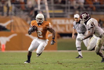 AUSTIN, TX - NOVEMBER 27:  Vondrell McGee #2 of the Texas Longhorns carries the ball against Matt Featherston #46 of the Texas A&M Aggies on November 27, 2008 at Darrell K Royal-Texas Memorial Stadium in Austin, Texas.  Texas won 49-9. (Photo by Brian Bahr/Getty Images)