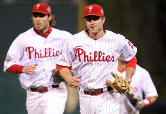 PHILADELPHIA - OCTOBER 27:  Chase Utley #26 (R) and Jayson Werth #28 of the Philadelphia Phillies run back to the dugout after the bottom of the second inning against the Tampa Bay Rays during game five of the 2008 MLB World Series on October 27, 2008 at Citizens Bank Park in Philadelphia, Pennsylvania.  (Photo by Jed Jacobsohn/Getty Images)