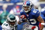 EAST RUTHERFORD, NJ - DECEMBER 07: Sinorice Moss #83 of the New York Giants returns a kickoff against the Philadelphia Eagles at Giants Stadium on December 7, 2008 in East Rutherford, New Jersey.  (Photo by Nick Laham/Getty Images)