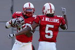 RALEIGH, NC - OCTOBER 27:  Teammates Jarvis Williams #5 and Donald Bowens #80 of the North Carolina State Wolfpack celebrate after Bowens' touchdown against the Virginia Cavaliers during their game at Carter-Finley Stadium October 27, 2007 in Raleigh, North Carolina.  (Photo by Streeter Lecka/Getty Images)