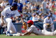 LOS ANGELES - APRIL 3: Erick Aybar #32 of the Los Angeles Angels of Anaheim slides safely into third base in the ninth inning against the Los Angeles Dodger during an exhibition game on April 3, 2004 at Dodger Stadium in Los Angeles, California. The Angels defeated the Dodgers 6-4. (Photo by Lisa Blumenfeld/Getty Images)