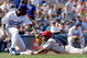 LOS ANGELES - APRIL 3:  Erick Aybar #32 of the Los Angeles Angels of Anaheim slides safely into third base in the ninth inning against the Los Angeles Dodger during an exhibition game on April 3, 2004 at Dodger Stadium in Los Angeles, California. The Angels defeated the Dodgers 6-4.  (Photo by Lisa Blumenfeld/Getty Images)