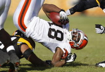 PITTSBURGH - DECEMBER 28: Donte Stallworth #18 of the Cleveland Browns is tackled after a first quarter catch by Tyrone Carter #23 and Andre Frazier #54 of the Pittsburgh Steelers at Heinz Field December 28, 2008 in Pittsburgh, Pennsylvania. (Photo by Gregory Shamus/Getty Images)