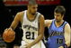 SAN ANTONIO - MAY 20:  Tim Duncan #21 of the San Antonio Spurs posts up Mehmet Okur #13 of the Utah Jazz in the third quarter of Game One of the Western Conference Finals during the 2007 NBA Playoffs at AT&T Center on May 20, 2007 in San Antonio, Texas. NOTE TO USER: User expressly acknowledges and agrees that, by downloading and or using this photograph, User is consenting to the terms and conditions of the Getty Images License Agreement.  (Photo by Lisa Blumenfeld/Getty Images)