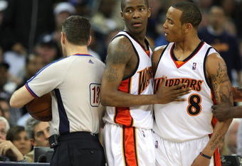 OAKLAND, CA - MARCH 30:  Monta Ellis #8 of the Golden State Warriors is restrained by teammate Jamal Crawford #6 after being called for a technical foul by referee Monty McCutchen against the Memphis Grizzlies during an NBA game on March 30, 2009 at Oracle Arena in Oakland, California. NOTE TO USER: User expressly acknowledges and agrees that, by downloading and or using this photograph, User is consenting to the terms and conditions of the Getty Images License Agreement.  (Photo by Jed Jacobsohn/Getty Images)