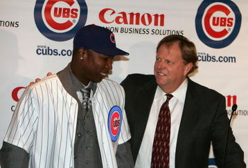 CHICAGO - NOVEMBER 30:  General manager Jim Hendry (R) of the Chicago Cubs introduces Alfonso Soriano #12 during a press conference to announce the sigining of Soriano to an eight year free agent contract November 30, 2006 at the Stadium Club at Wrigley Field in Chicago, Illinois.  (Photo by Chris Chambers/Getty Images)