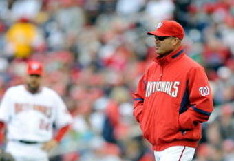 WASHINGTON - APRIL 13:  Manager Manny Acta of the Washington Nationals walks out to the pitchers mound during the game against the Philadelphia Phillies at Nationals Park on April 13, 2009 in Washington, DC.  (Photo by Greg Fiume/Getty Images)