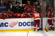 DETROIT - JUNE 12:  Brad Stuart #23, second from left, and Nicklas Lidstrom #5 of the Detroit Red Wings look on dejectedly after Game Seven of the 2009 NHL Stanley Cup Finals against the Pittsburgh Penguins at Joe Louis Arena on June 12, 2009 in Detroit, Michigan. The Penguins defeated the Red Wings 2-1 in the seventh game to win the Stanley Cup Finals series 4 games to 3. (Photo by Harry How/Getty Images)