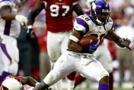 GLENDALE, AZ - DECEMBER 14:  Runningback Adrian Peterson #28 of the Minnesota Vikings breaks the tackle of Adrian Wilson #24 of the Arizona Cardinals during the game at the University of Phoenix Stadium on December 14, 2008 in Glendale, Arizona. The Vikings defeated the Cardinals 35-14.  (Photo by Jeff Gross/Getty Images)