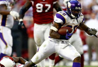 GLENDALE, AZ - DECEMBER 14:  Runningback Adrian Peterson #28 of the Minnesota Vikings breaks the tackle of Adrian Wilson #24 of the Arizona Cardinals during the game at the University of Phoenix Stadium on December 14, 2008 in Glendale, Arizona. The Vikings defeated the Cardinals 35-14.  (Photo by Jeff Gross/Getty Images)