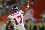 GLENDALE, AZ - FEBRUARY 03:  Wide receiver Plaxico Burress #17 of the New York Giants celebrates after catching a 13-yard touchdown pass in the fourth quarter against the New England Patriots during Super Bowl XLII on February 3, 2008 at the University of Phoenix Stadium in Glendale, Arizona.  The Giants defeated the Patriots 17-14.  (Photo by Donald Miralle/Getty Images)