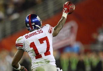 GLENDALE, AZ - FEBRUARY 03:  Wide receiver Plaxico Burress #17 of the New York Giants celebrates after catching a 13-yard touchdown pass in the fourth quarter against the New England Patriots during Super Bowl XLII on February 3, 2008 at the University of Phoenix Stadium in Glendale, Arizona.  The Giants defeated the Patriots 17-14.  (Photo by Donald Miralle/Getty Images)