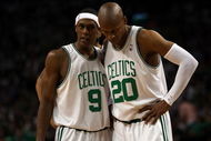 BOSTON - MAY 17:  Rajon Rondo #9 and Ray Allen #20 of the Boston Celtics talk as the Orlando Magic shoot a free throw in Game Seven of the Eastern Conference Semifinals during the 2009 NBA Playoffs at TD Banknorth Garden on May 17, 2009 in Boston, Massachusetts. The Orlando Magic defeated the Boston Celtics 101-82 to advance to the Eastern Conference Finals. NOTE TO USER: User expressly acknowledges and agrees that, by downloading and or using this photograph, User is consenting to the terms and conditions of the Getty Images License Agreement.  (Photo by Elsa/Getty Images)
