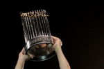 HOUSTON - OCTOBER 26:  Manager Ozzie Guillen #13 of the Chicago White Sox celebrates with the Championship trophy after winning Game Four of the 2005 Major League Baseball World Series against the Houston Astros at Minute Maid Park on October 26, 2005 in Houston, Texas. The Chicago White Sox defeated the Houston Astros 1-0 to win the World Series 4 games to 0.  (Photo by Elsa/Getty Images)