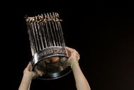 HOUSTON - OCTOBER 26:  Manager Ozzie Guillen #13 of the Chicago White Sox celebrates with the Championship trophy after winning Game Four of the 2005 Major League Baseball World Series against the Houston Astros at Minute Maid Park on October 26, 2005 in Houston, Texas. The Chicago White Sox defeated the Houston Astros 1-0 to win the World Series 4 games to 0.  (Photo by Elsa/Getty Images)