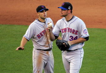 SAN FRANCISCO - MAY 17:  David Wright #5 speaks to Mike Pelfrey #34 of the New York Mets after two runners got on base in the sixth inning of their game against the San Francisco Giants during their game at AT&T Park on May 17, 2009 in San Francisco, California.  (Photo by Ezra Shaw/Getty Images)