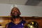 ORLANDO, FL - JUNE 14:  DJ Mbenga #28 of the Los Angeles Lakers holds the Larry O'Brien trophy in the locker room after the Lakers defeated the Orlando Magic 99-86 in Game Five of the 2009 NBA Finals on June 14, 2009 at Amway Arena in Orlando, Florida.  NOTE TO USER:  User expressly acknowledges and agrees that, by downloading and or using this photograph, User is consenting to the terms and conditions of the Getty Images License Agreement.  (Photo by Ronald Martinez/Getty Images)
