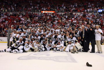 DETROIT - JUNE 12:  The Pittsburgh Penguins celebrate with the Stanley Cup after defeating the Detroit Red Wings by a score of 2-1 to win Game Seven and the 2009 NHL Stanley Cup Finals at Joe Louis Arena on June 12, 2009 in Detroit, Michigan.  (Photo by Jim McIsaac/Getty Images)