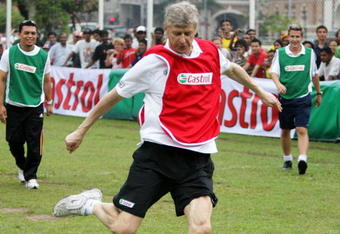 KUALA LUMPUR, MALAYSIA - JUNE 9:   Arsene Wenger meets the fans before taking the Malaysian youth team through the Castrol Challenge at the Dataran Merdeka Square during his tour of Asia with FIFA World Cup sponsor Castrol on June 9, 2008 in Kuala Lumpur, Malaysia.  (Photo by Adam Pretty / Getty Images for Castrol)
