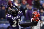BALTIMORE - NOVEMBER 05:  Chris McAlister #21 of the Baltimore Ravens makes an interception in front of Chris Henry #15 of the Cincinnati Bengals to preserve a 26-20 Ravens win during the fourth quarter on November 5, 2006 at M&T Bank Stadium in Baltimore, Maryland.  (Photo by Harry How/Getty Images)