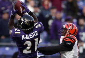 BALTIMORE - NOVEMBER 05:  Chris McAlister #21 of the Baltimore Ravens makes an interception in front of Chris Henry #15 of the Cincinnati Bengals to preserve a 26-20 Ravens win during the fourth quarter on November 5, 2006 at M&T Bank Stadium in Baltimore, Maryland.  (Photo by Harry How/Getty Images)