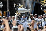PITTSBURGH - JUNE 15:  Sidney Crosby #87 of the Pittsburgh Penguins holds the Stanley Cup as Maxime Talbot #25 of the Penguins sprays the crowd during Stanley Cup Champion Victory Parade on June 15, 2009 in Pittsburgh, Pennsylvania.  (Photo by Jamie Sabau/Getty Images)