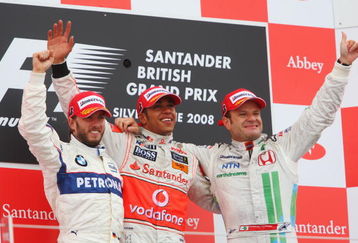 NORTHAMPTON, UNITED KINGDOM - JULY 06:  Race winner Lewis Hamilton (C) of Great Britain and McLaren Mercedes celebrates on the podium alongside second placed Nick Heidfeld (L) of Germany and BMW Sauber and third placed Rubens Barrichello (R) of Brazil and Honda Racing after the British Formula One Grand Prix at Silverstone on July 6, 2008 in Northampton, England.  (Photo by Mark Thompson/Getty Images)