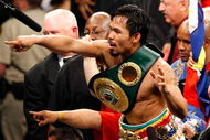 LAS VEGAS - MAY 02:  Manny Pacquiao of the Philippines celebrates after knocking out Ricky Hatton of England in the second round of their junior welterweight title fight at the MGM Grand Garden Arena May 2, 2009 in Las Vegas, Nevada.  (Photo by Ethan Miller/Getty Images)