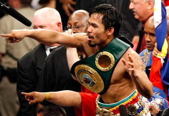 LAS VEGAS - MAY 02:  Manny Pacquiao of the Philippines celebrates after knocking out Ricky Hatton of England in the second round of their junior welterweight title fight at the MGM Grand Garden Arena May 2, 2009 in Las Vegas, Nevada.  (Photo by Ethan Miller/Getty Images)