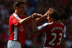 LONDON, ENGLAND - MAY 24:  Robin Van Persie of Arsenal celebrates with Andrey Arshavin (R) after scoring his team's second goal during the Barclays Premier League match between Arsenal and Stoke City at Emirates Stadium on May 24, 2009 in London, England.  (Photo by Ryan Pierse/Getty Images)