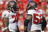 KANSAS CITY, MO - NOVEMBER 02:  Jeremy Zuttah #76 of the Tampa Bay Buccaneers talks with teammate Jeff Faine #52 during the NFL game against the Kansas City Chiefs on November 2, 2008 at Arrowhead Stadium in Kansas City, Missouri.  The Buccaneers won 30 to 27 in overtime. (Photo by: Jamie Squire/Getty Images)