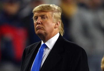 FOXBOROUGH, MA - JANUARY 12:  Donald Trump stands on the sidelines before the start of the AFC Divisional playoff game between the New England Patriots and the Jacksonville Jaguars during the AFC Divisional playoff game at Gillette Stadium game on January 12, 2008 in Foxboro, Massachusetts.  (Photo by Elsa/Getty Images)