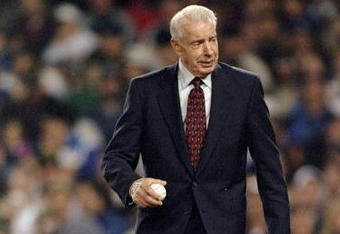 20 Oct 1996:  Baseball great Joe Dimaggio walks out to the pitchers mound to throw out the first pitch of the 1996 World Series Game One between the Atlanta Braves and the New York Yankees at Yankee Stadium in the Bronx, New York. The Braves defeated the Yankees 12-1. Mandatory Credit: Doug Pensinger  /Allsport