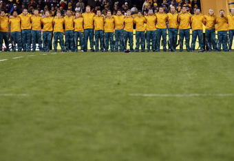 CANBERRA, AUSTRALIA - JUNE 13:  Wallaby players sing the Australian national anthem before the First Test match between the Australian Wallabies and Italy at Canberra Stadium on June 13, 2009 in Canberra, Australia.  (Photo by Cameron Spencer/Getty Images)