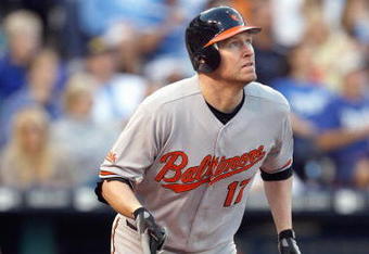 KANSAS CITY - MAY 14:  Aubrey Huff #17 of the Baltimore Orioles makes a hit against the Kansas City Royals on May 14, 2009 at Kauffman Stadium in Kansas City, Missouri. (Photo by: Jamie Squire/Getty Images)