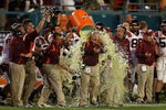 MIAMI - JANUARY 01:  Head coach Frank Beamer of the Virginia Tech Hokies gets gatorade dump on him by his players on their way to winning against the Cincinnati Bearcats during the FedEx Orange Bowl at Dolphin Stadium on January 1, 2009 in Miami, Florida.  (Photo by Doug Benc/Getty Images)