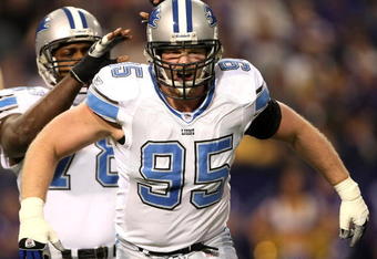 MINNEAPOLIS - DECEMBER 2:  Defensive linemen Jared DeVries #95 and Cory Redding #78 of the Detroit Lions celebrate DeVries' sack against the Minnesota Vikings at the Metrodome December 2, 2007 in Minneapolis, Minnesota. The Vikings won 42-10.  (Photo by Stephen Dunn/Getty Images)