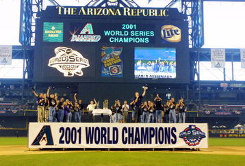 PHOENIX - NOVEMBER 7: The Arizona Diamondbacks wave to fans inside Bank One Ballpark during a parade held to celebrate the Diamondbacks World Series victory over the New York Yankees in Phoenix, Arizona on November 7, 2001. (Photo by Jeff Gross/Getty Images)