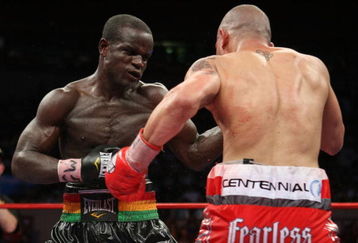 NEW YORK - JUNE 13:  Joshua Clottey punches Miguel Cotto during their WBO Welterweight title fight at Madison Square Garden  on June 13, 2009 in New York, New York.  (Photo by Al Bello/Getty Images)