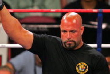 EAST RUTHERFORD, NJ - AUGUST 02:  Dan Miragliotta declares Mike Ciesnolevicz (yellow) of the Quad Cities Silverbacks the winner in a spilt decision over Alex Schoenauer of the Los Angeles Anacondas during the IFL semifinals at the Continental Airlines Arena on August 2, 2007 in East Rutherford, New Jersey.  (Photo by Michael Heiman/Getty Images for IFL)
