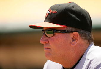 OAKLAND, CA - JUNE 07:  Baltimore Orioles manager Dave Trembley stands in the dugout before their game against the Oakland Athletics at the Oakland Coliseum on June 7, 2009 in Oakland, California.  (Photo by Ezra Shaw/Getty Images)