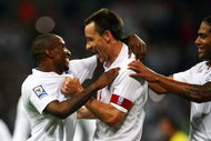 LONDON, ENGLAND - JUNE 10:  Jermain Defoe (L) of England celebrates scoring the 5th goal of the game with John Terry and Glen Johnson during the FIFA 2010 World Cup Group 6 Qualifying match between England and Andorra at Wembley Stadium on June 10, 2009 in London, England.  (Photo by Phil Cole/Getty Images)