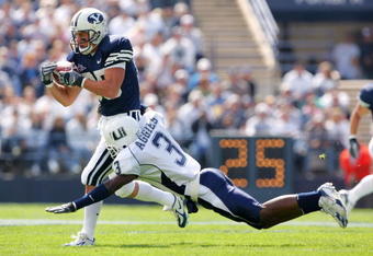PROVO, UT - SEPTEMBER 23:  Zac Collie #85 of the Brigham Young Cougars catches the ball against Marquise Charles #3 of the Utah State Aggies on September 23, 2006 at La Vell Edwards Stadium in Provo, Utah.  (Photo By Kent Horner/Getty Images)