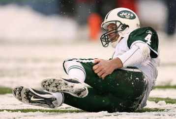 SEATTLE - DECEMBER 21:  Quarterback Brett Favre #4 of the New York Jets gets back up after being tackled by Brandon Mebane of the Seattle Seahawks on the final possession on December 21, 2008 at Qwest Field in Seattle, Washington. The Seahawks defeated the Jets 13-3. (Photo by Otto Greule Jr/Getty Images)