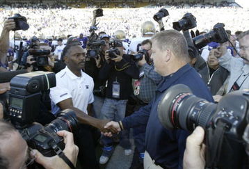 SEATTLE - SEPTEMBER 24:  Head Coach Tyrone Willingham of the Washington Huskies (L) shakes hands after the game with Head Coach Charlie Weis of the Notre Dame Fighting Irish on September 24, 2005 at Husky Stadium in Seattle, Washington. The Irish defeated the Huskies 36-17. (Photo by Otto Greule Jr/Getty Images) 