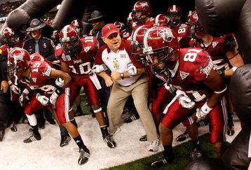 NEW ORLEANS - DECEMBER 21:  Members of the Troy Trojans prepare to take the field against the Southern Mississippi Golden Eagles during the R+L Carriers New Orleans Bowl on December 21, 2008 at the Superdome in New Orleans, Louisiana.  (Photo by Chris Graythen/Getty Images)