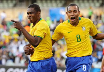 BLOEMFONTEIN, SOUTH AFRICA - JUNE 15:  Juan #4 of Brazil celebrates his goal with Gilberto Silva #8 against Egypt during the first half of the FIFA Confederations Cup match between Brazil and Egypt at Free State stadium on June 15, 2009 in Bloemfontein, South Africa.  (Photo by Kevork Djansezian/Getty Images)